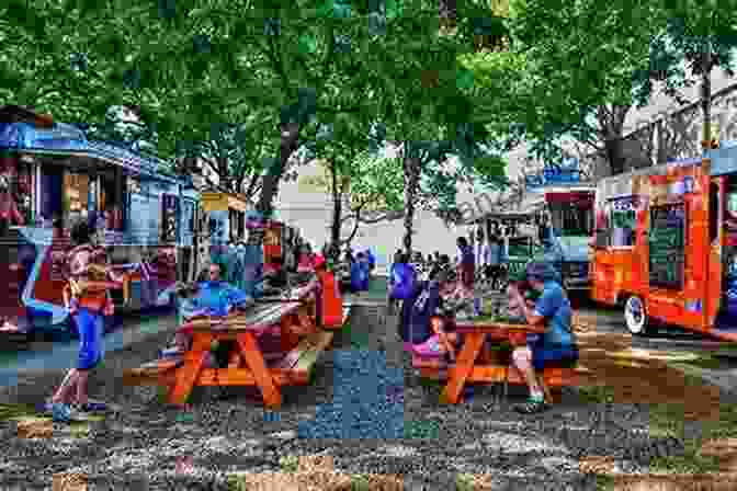 A Food Truck Parked In A Park Surrounded By People Enjoying Food And Drinks Food Trucks Mark Todd