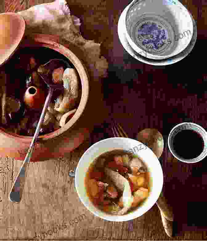 A Steaming Bowl Of San Qi Chicken Soup, With Its Vibrant Red Goji Berries Floating On The Surface The Comforting Chinese Soup Cookbook: Tasty Chinese Soup Recipes To Warm You On Chilly Nights