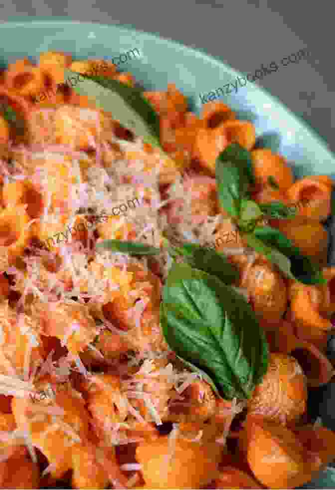 A Vibrant Plate Of Roasted Red Pepper Pasta, Adorned With Fresh Basil And Parmesan Shavings The Gluten Free Vegan: 150 Delicious Gluten Free Animal Free Recipes